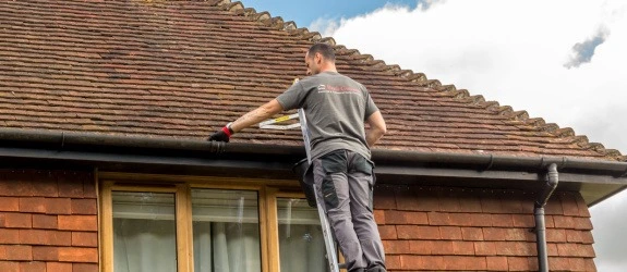 our team cleaning the gutters on a house in Stoke Bishop, Merseyside